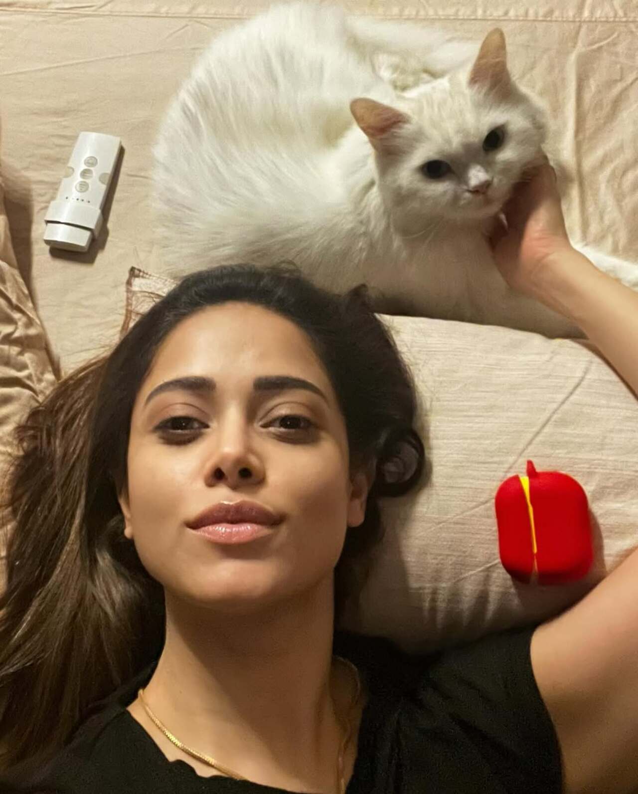 Snuggling with her pet, Noah, Nushrat shows how much she cherishes these peaceful interactions, soft, quiet, and deeply felt.
